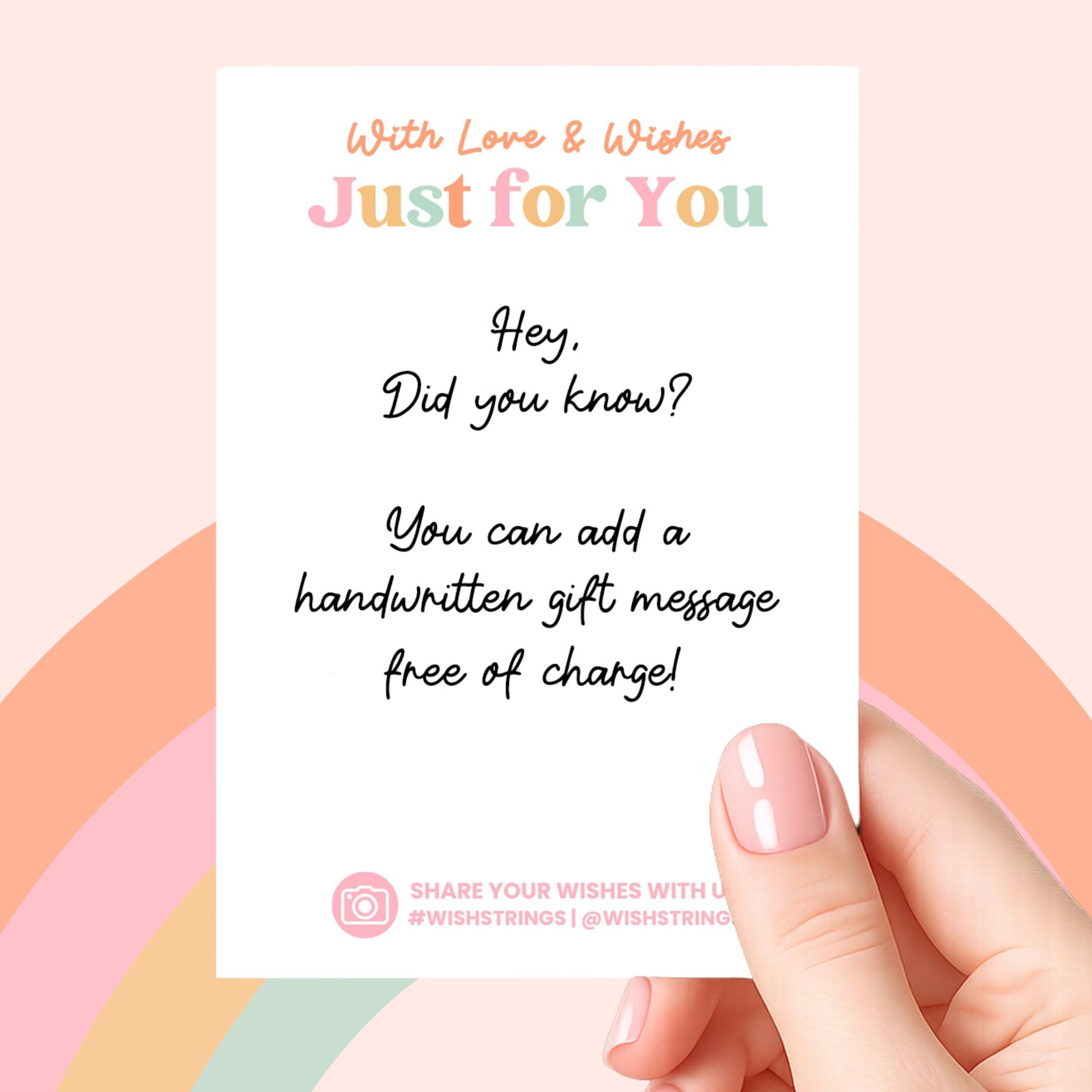 a hand holding a card with a handwritten message on it, against a colorful background.