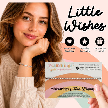a smiling woman holding a bracelet and a small card with text and logos.