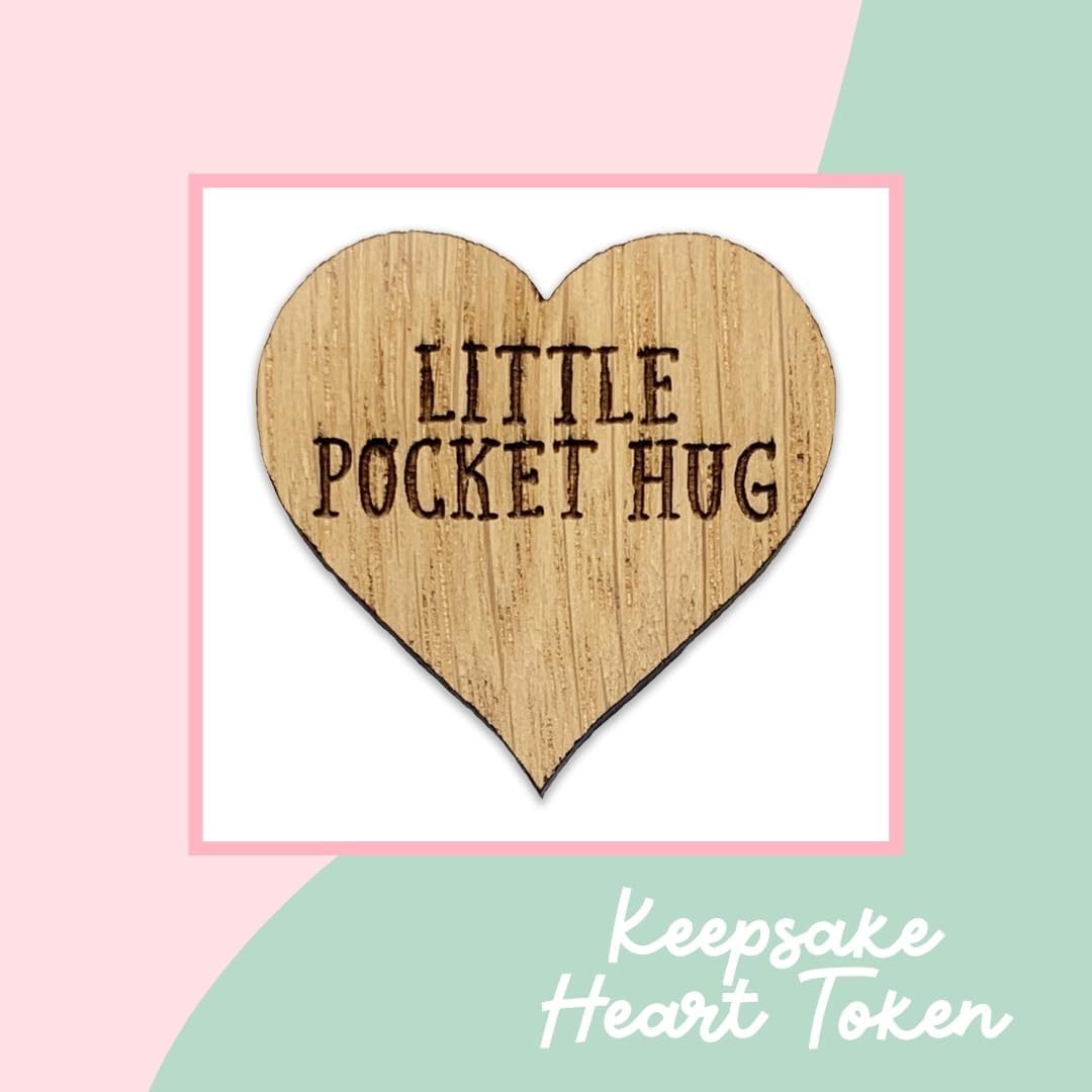 a wooden heart with the words little pocket hug on it