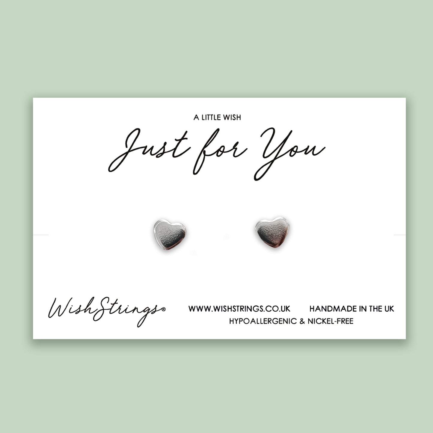 a pair of heart shaped earrings with the words, just for you