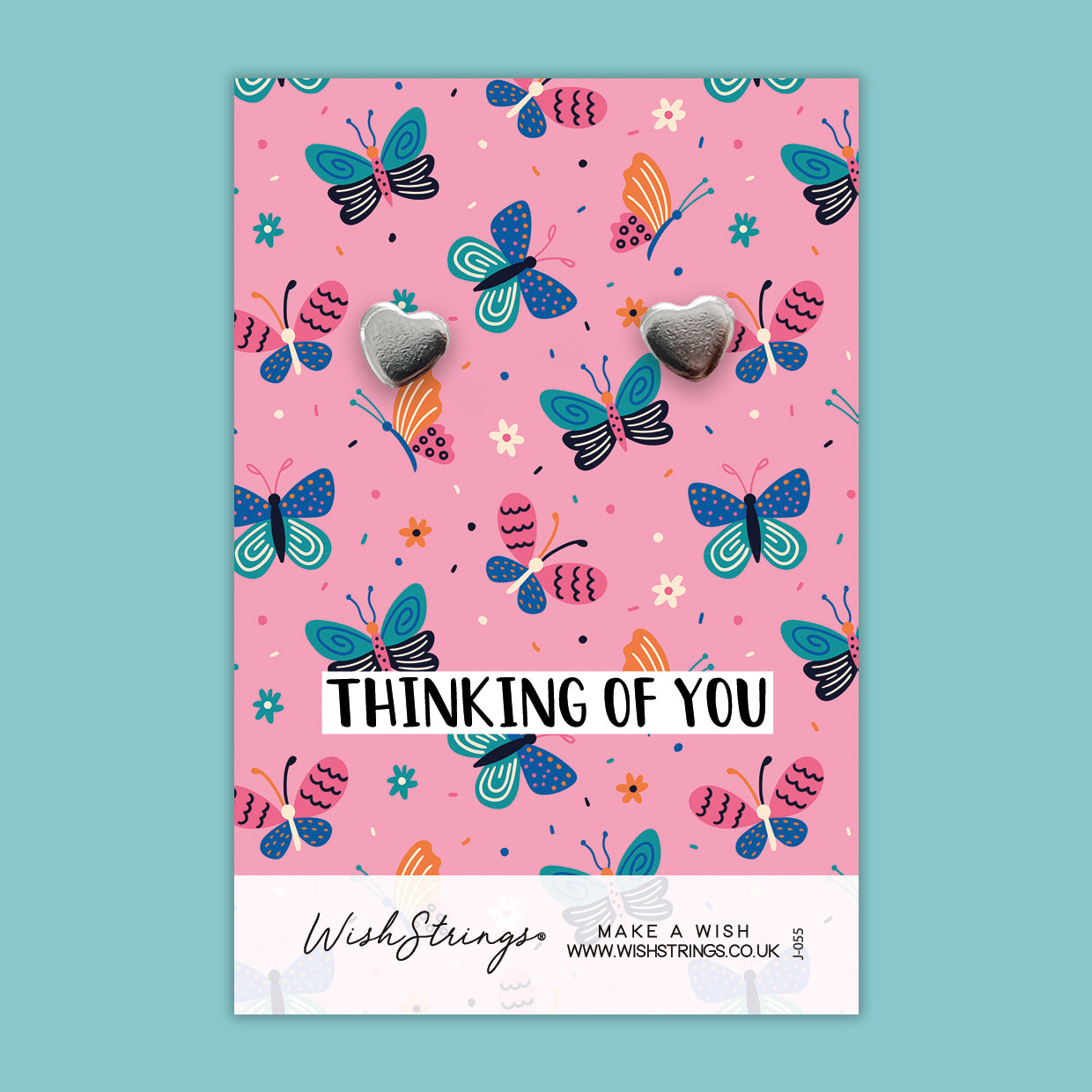 a pink card with butterflies on it