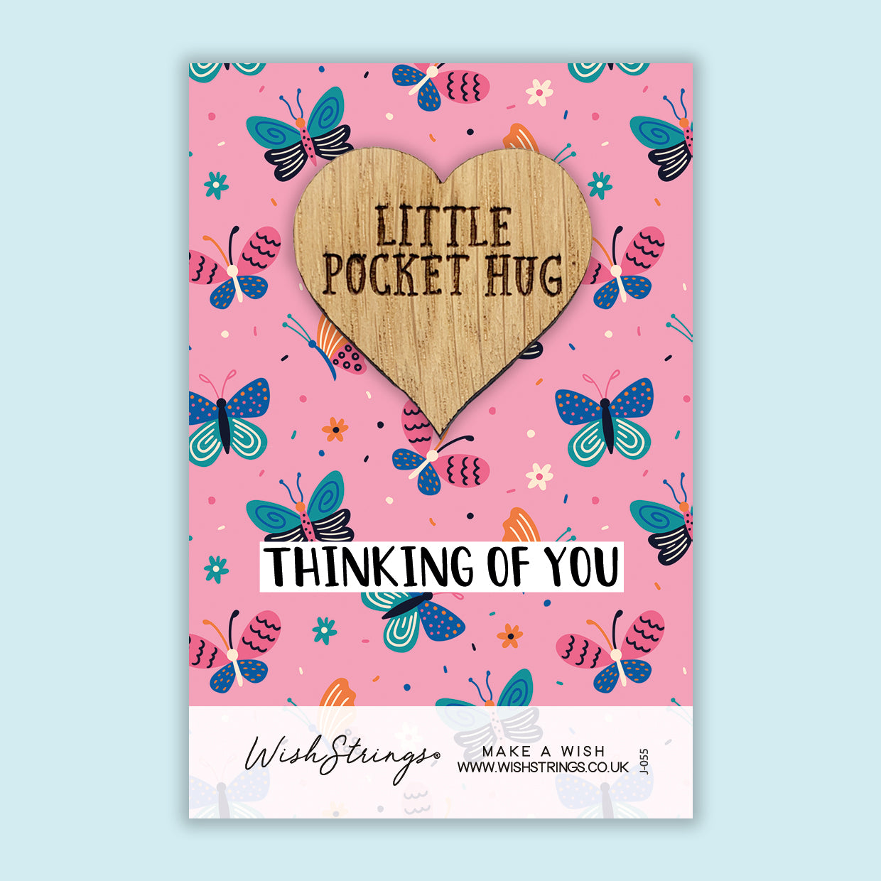 a card with a wooden heart that says, little pocket hug thinking of you